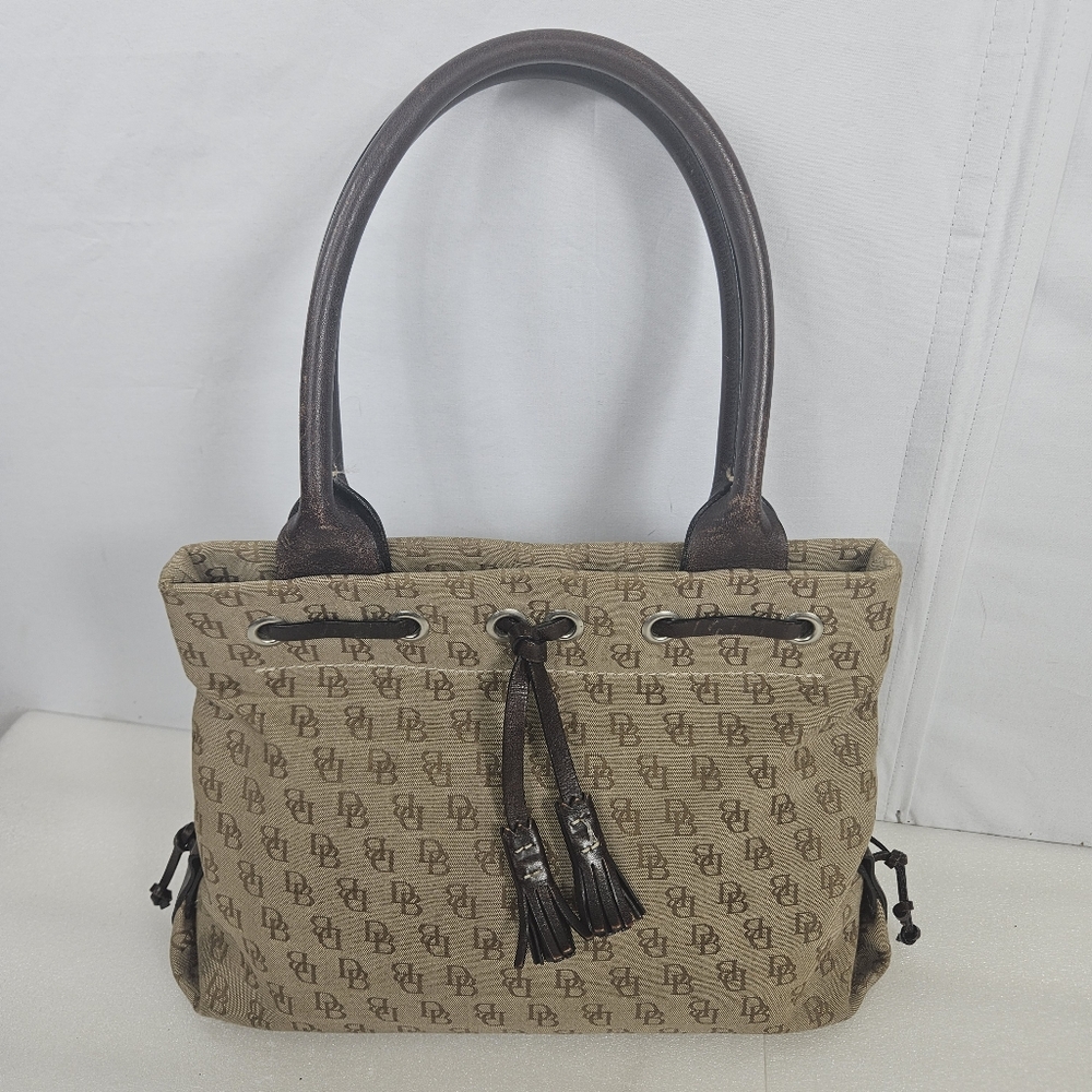 Vintage Dooney & Bourke tan with signature DB and tassels tassels